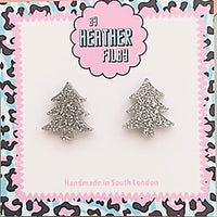 Silver tree-shaped earrings on a branded card with decorative border