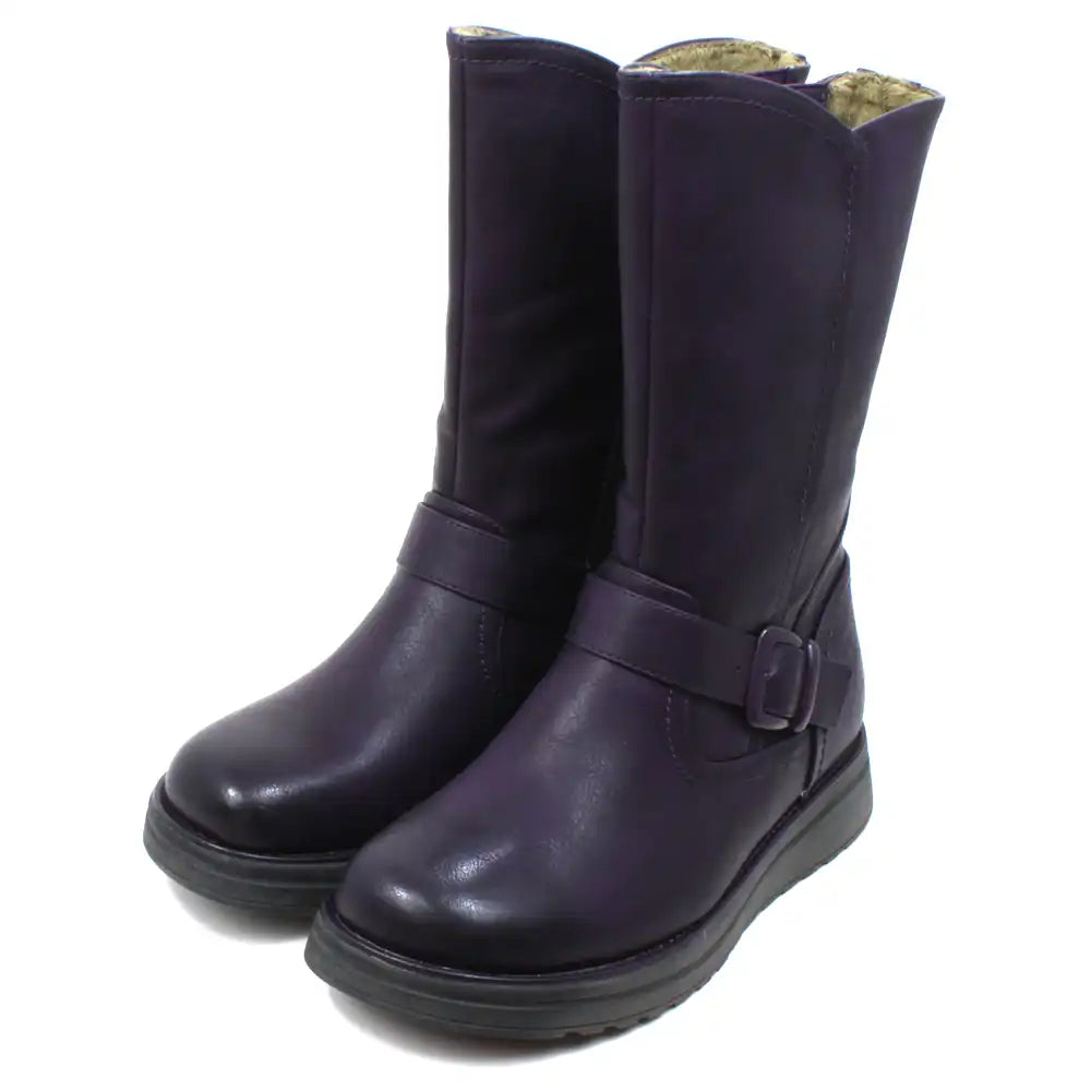 Heavenly Feet Bella purple calf height boots with goldie beige fleece lining. Wedge soles and strap across front of ankle with a purple buckle detail. Fitting is by zip on the inside of the boot and accompanied by a nearby elastic panel for comfort. Angled view.