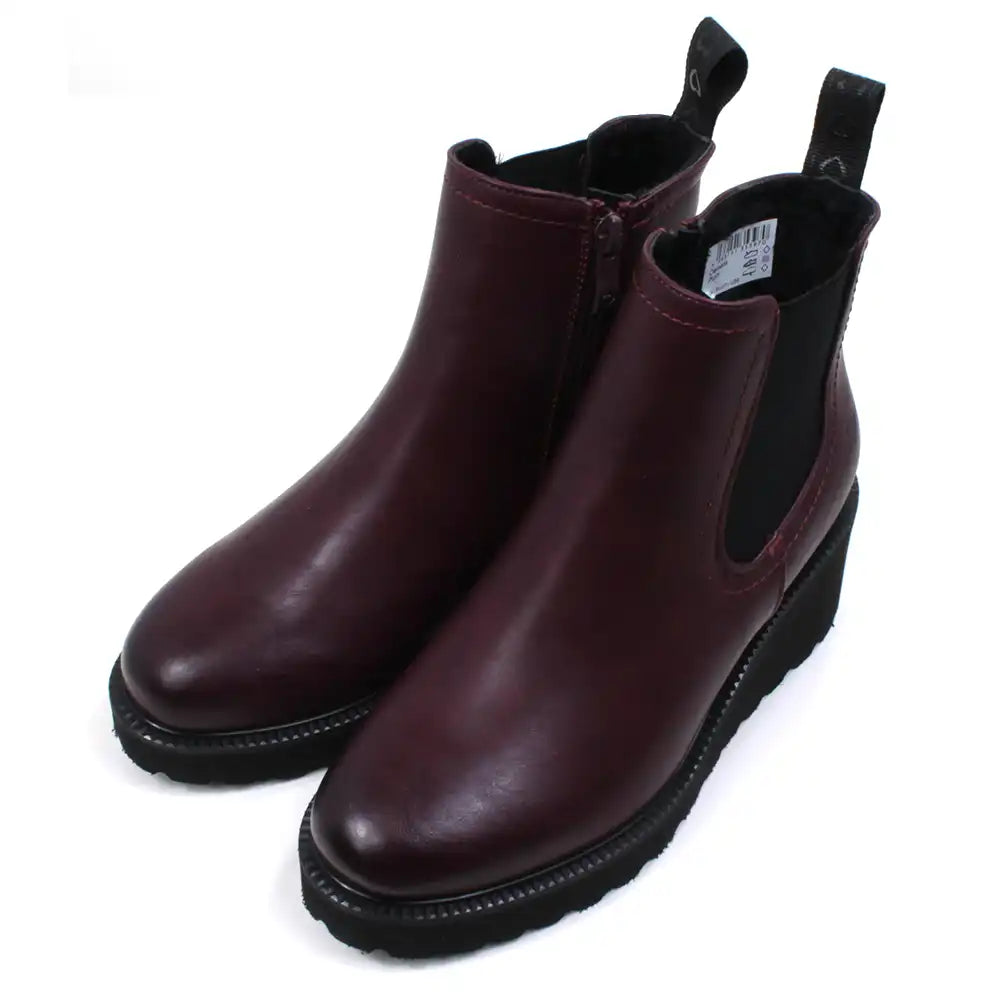 Pair of plum Chelsea boots on a white background at a side angle.