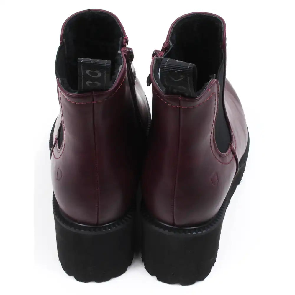 Pair of plum  ankle boots on a white background showing the back and the tab