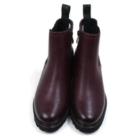 Front view of a pair of plum leather look Chelsea boots with an almond shaped toe on a white background