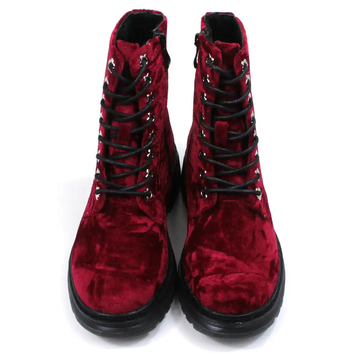 Red velour combat boots with rugged black soles and 8 hole laces. Fitted using zips. Front view.