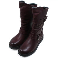 Burgundy calf height boots with buckles at the ankle and on the leg. Low heels. Angled view.