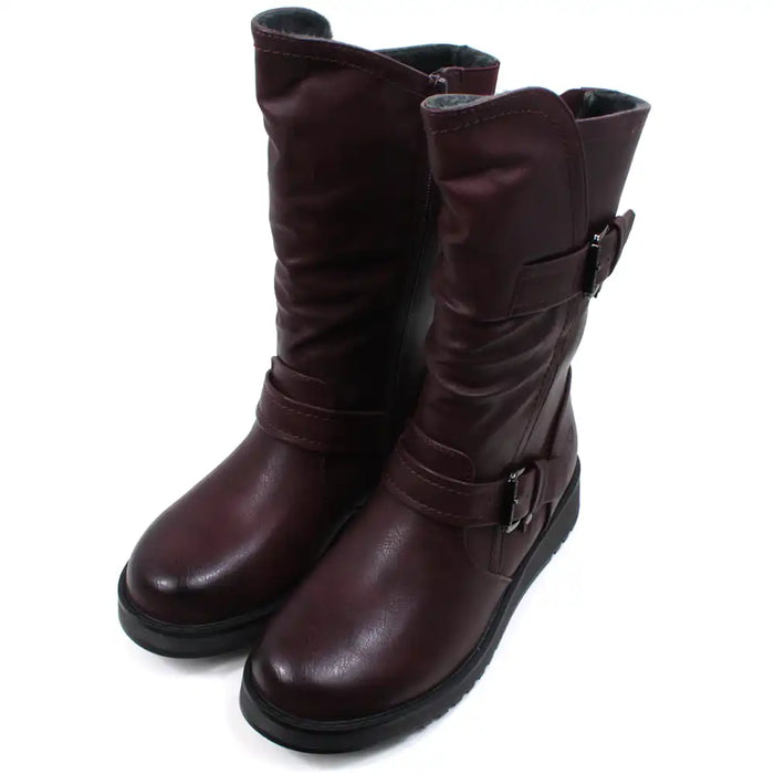 Burgundy calf height boots with buckles at the ankle and on the leg. Low heels. Angled view.