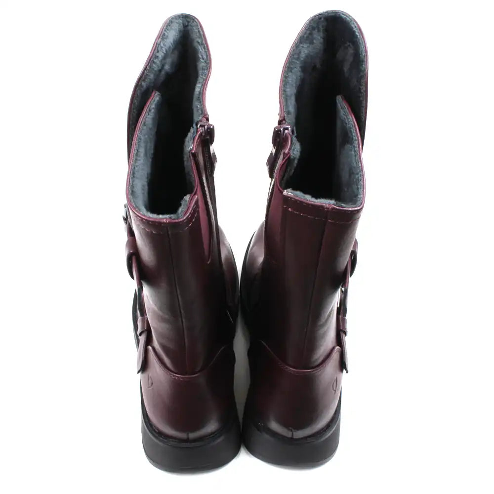 Burgundy calf height boots with buckles at the ankle and on the leg. Low heels. Back view showing grey fur interior.