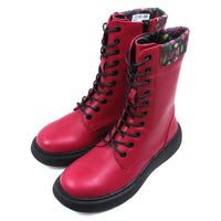 Bold red 10 lace boots with zip up fitting. Black low soles. Leaves fabric trim around cuffs. Angled view.