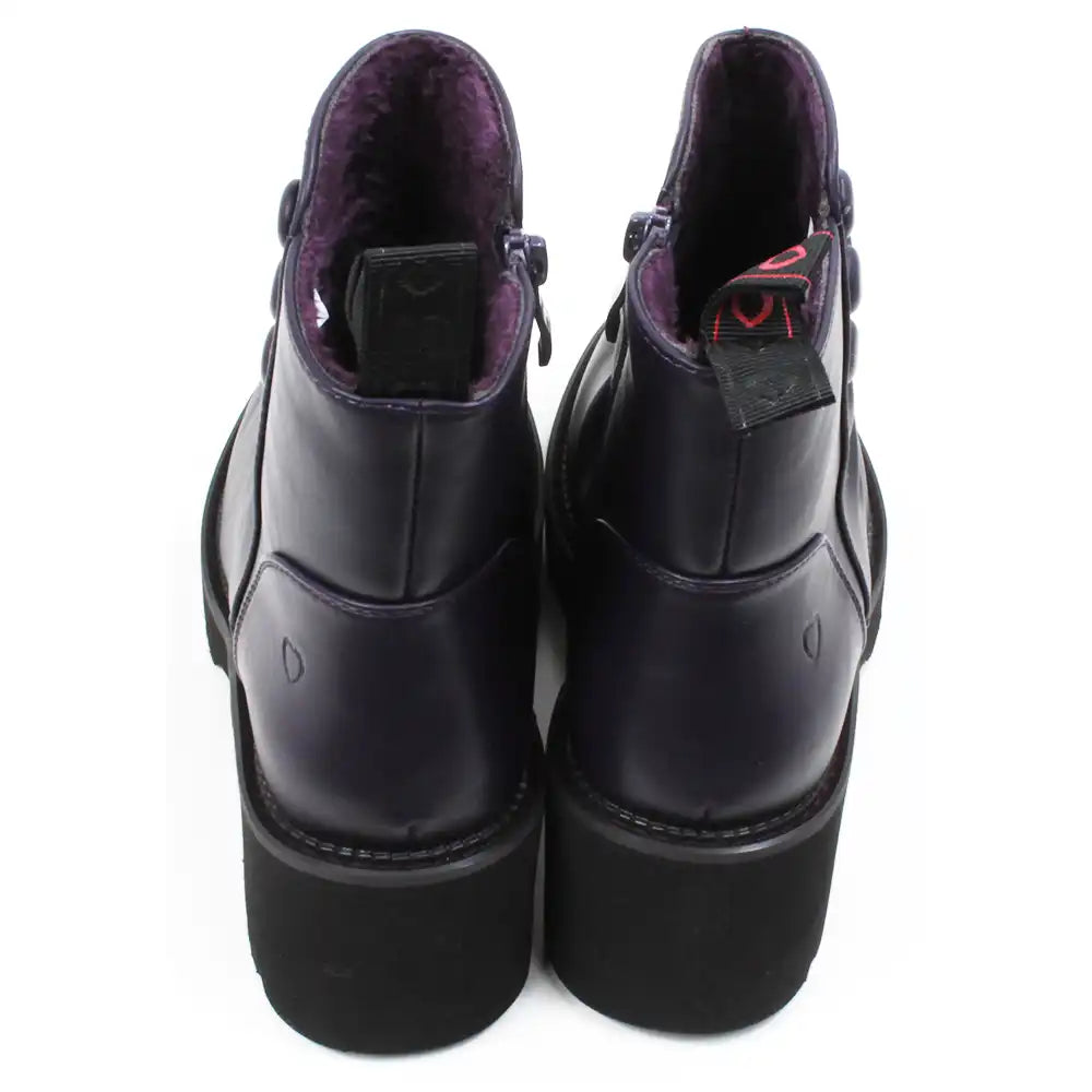 Purple ankle boots with three buttons detail on the ankles. Low black rubber heels. Back view.