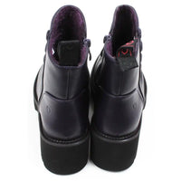 Purple ankle boots with three buttons detail on the ankles. Low black rubber heels. Back view.