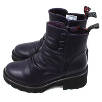 Purple ankle boots with three buttons detail on the ankles. Low black rubber heels. Side view.