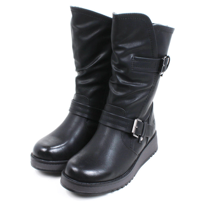 Heavenly Feet Hannah calf boots in black. Strap and buckle across the ankle and around the calf. Low wedge soles in black. Angled view.