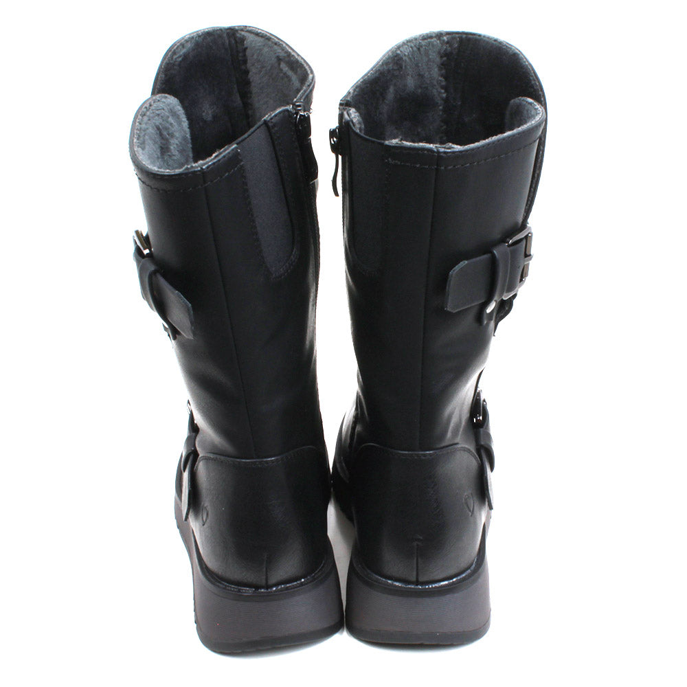 Heavenly Feet Hannah calf boots in black. Strap and buckle across the ankle and around the calf. Low wedge soles in black. Back view showing dark grey fleece inside.