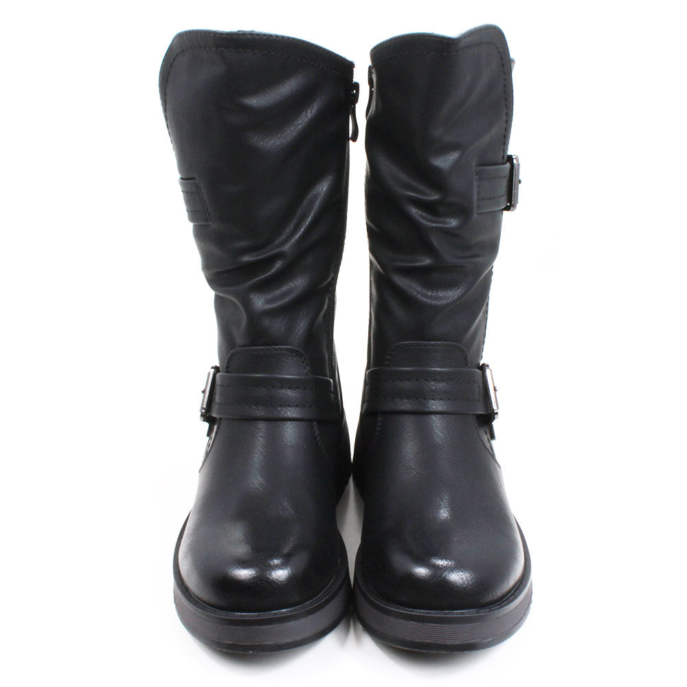 Heavenly Feet Hannah calf boots in black. Strap and buckle across the ankle and around the calf. Low wedge soles in black. Front view.