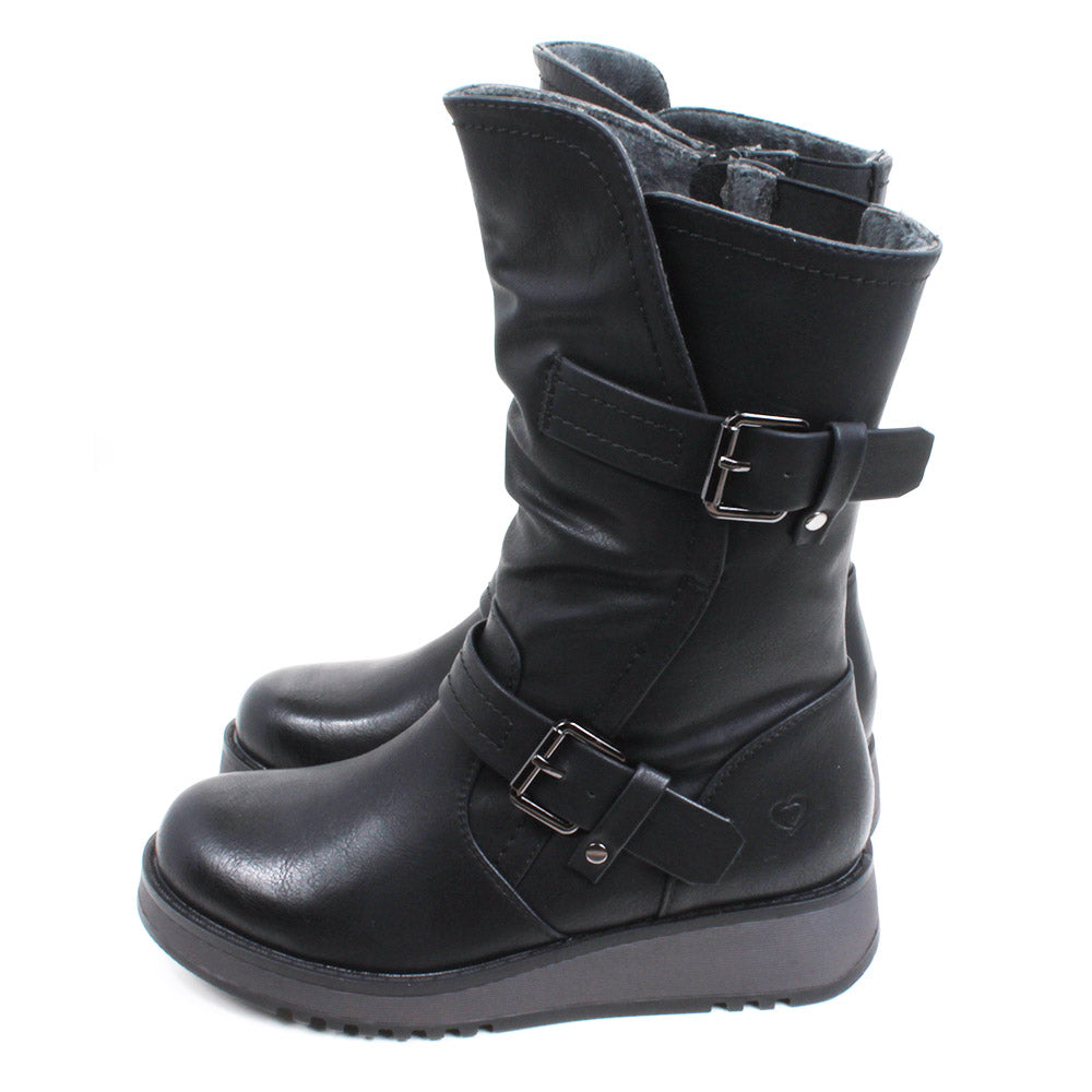 Heavenly Feet Hannah calf boots in black. Strap and buckle across the ankle and around the calf. Low wedge soles in black. Side view.