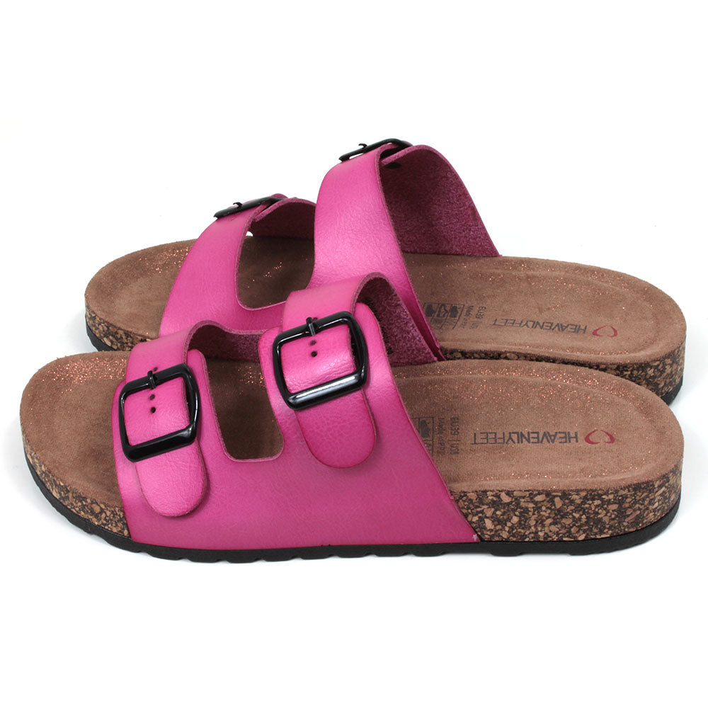 Pink double strap fuchsia pink sandals from Heavenly Feet. Backless, adjustment is with two black buckles. Cork effect sculpted footbeds with pink glitter sprinkled along the floor. Side view.