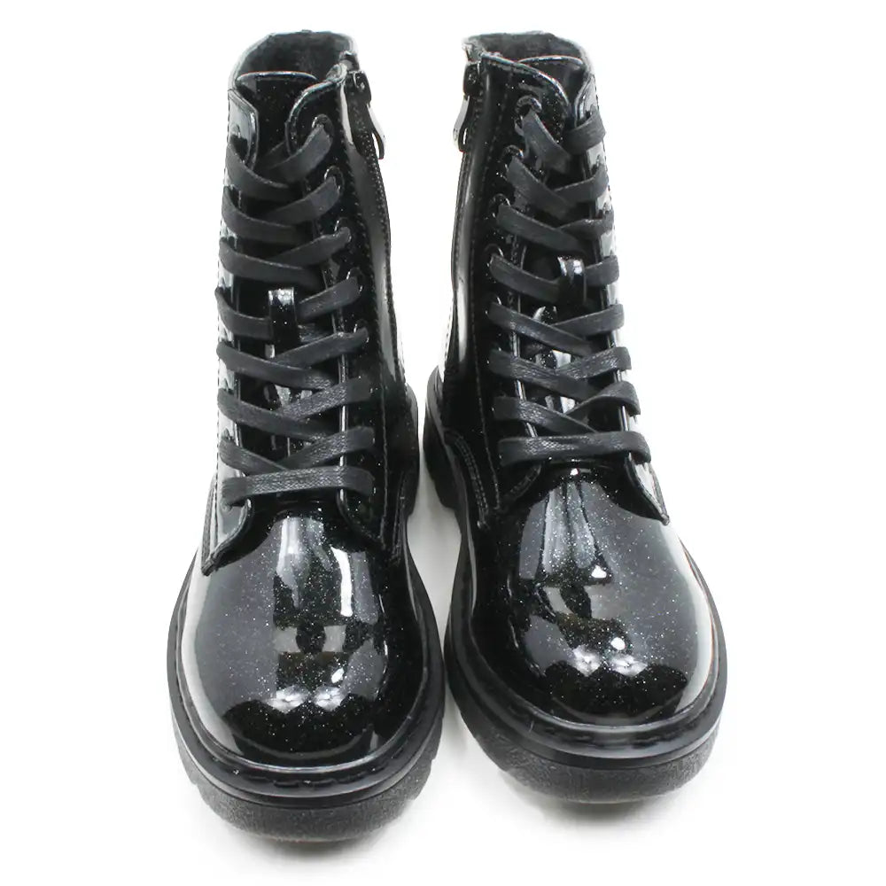 A pair of black patent leather lace-up ankle boots with side zippers, shown from the front on a white background.