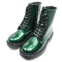 Eight eye laced boots with zips on the inside of the ankle. Patent glitter green colour. In a clean white environment.