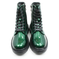 A pair of green glitter ankle boots with black laces and black soles, shown from a front-facing perspective on a white background.