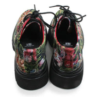 A pair of lace-up shoes shown from the back, featuring a vibrant, multicolored floral and abstract print on the uppers with solid black soles and black laces.