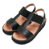 Black platform sandals on the white background.