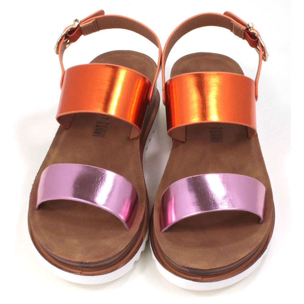Pink and orange metallic effect sandals with buckled ankle strap. Two wide over the foot straps. Tan coloured footbed. White rubber soles. Front view