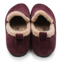 A pair of women's slip-on slippers in deep burgundy suede with a soft beige sherpa lining, shown from a top-down view on a white background.