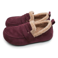 A pair of women's slip-on slippers in burgundy suede with a plush beige sherpa lining, shown on a clean white background.