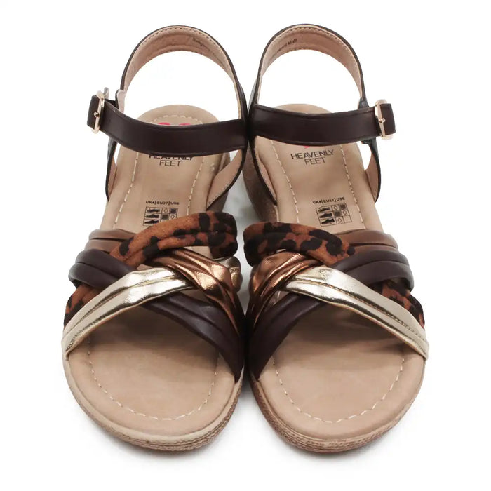 Wedge sandals with gold, brown and animal print straps.