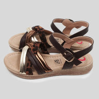 Wedge sandals with gold, brown and animal print straps.