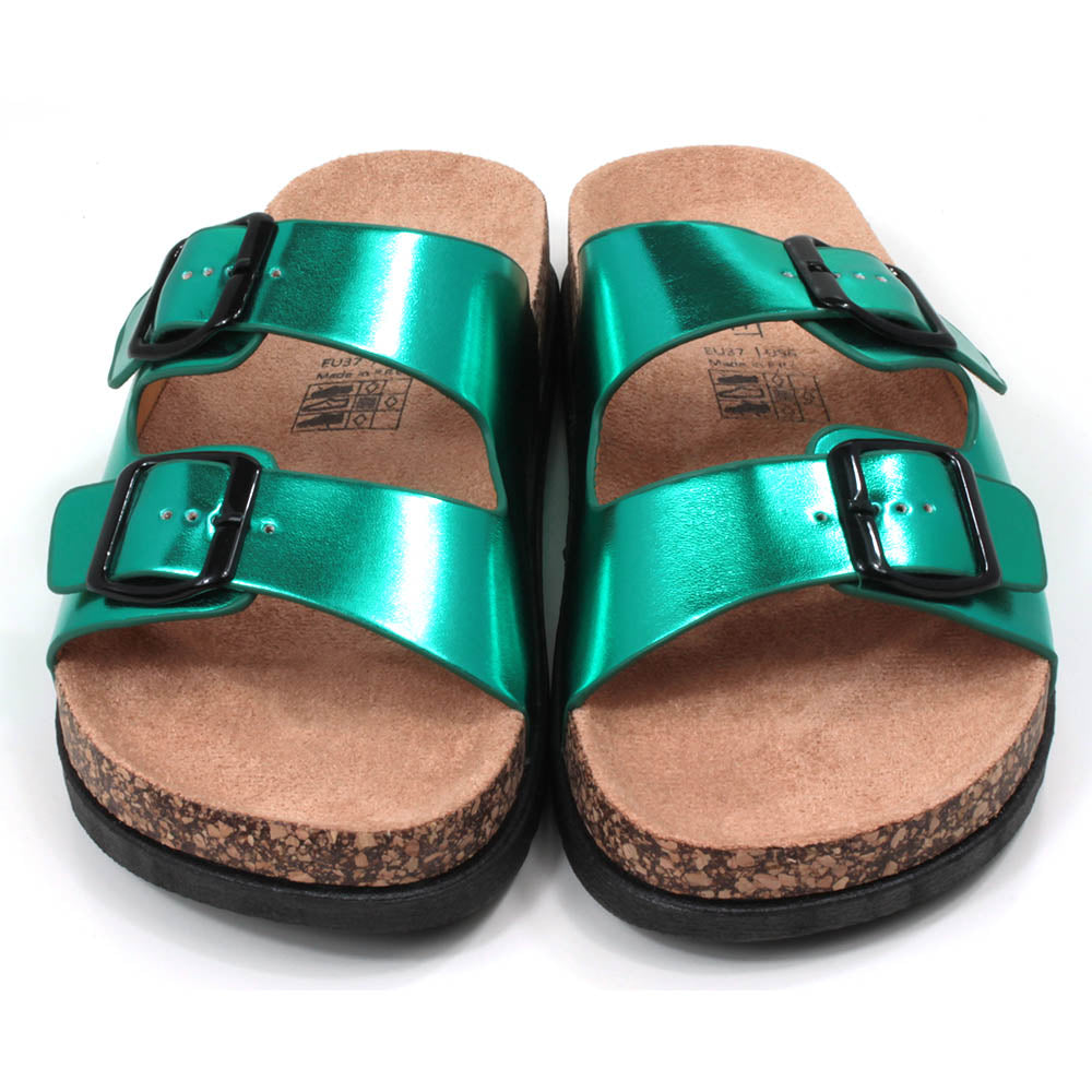 Metallic effect jade green double strap open backed sandals. Adjustments by black buckles. Cork effect, sculpted soles and footbeds. Front view. 