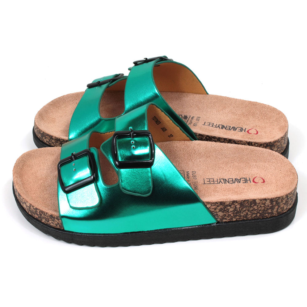 Metallic effect jade green double strap open backed sandals. Adjustments by black buckles. Cork effect, sculpted soles and footbeds. Side view. 