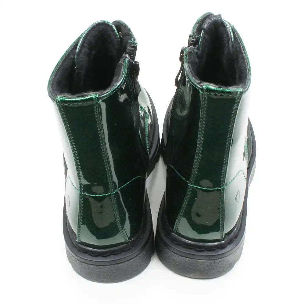 A pair of glossy dark glittery green ankle boots with black soles and black interior lining, shown from the back on a white background.