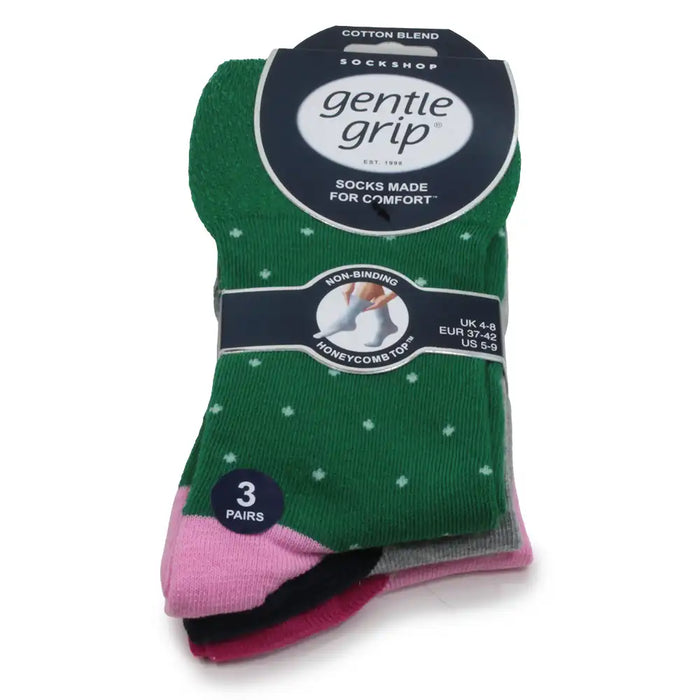 Pack of Gentle Grip socks with green with white spots on top.