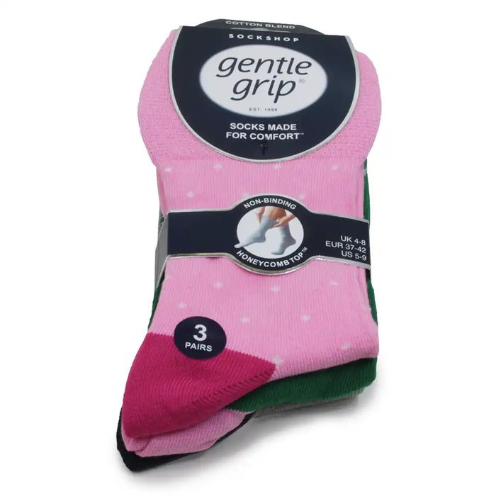 Pack of Gentle Grip socks with pink with white spots on top.