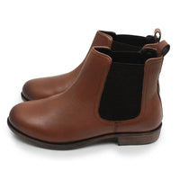 A pair of women's brown leather Chelsea boots with black elastic side panels, shown from a three-quarters angle on a white background.