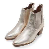 A pair of metallic champagne gold leather ankle boots with elastic side panels and low block heels, shown on a white background.