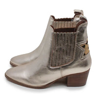 A pair of metallic silver Chelsea-style ankle boots with brown stacked block heels, elastic side panels, and a textured knit detail on the outer shaft, shown against a plain white background.