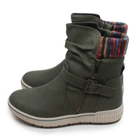 A pair of women's mid-calf boots in olive green faux leather, featuring a side zipper, a buckle strap, and a colorful striped knit lining visible at the collar, set against a plain white background.