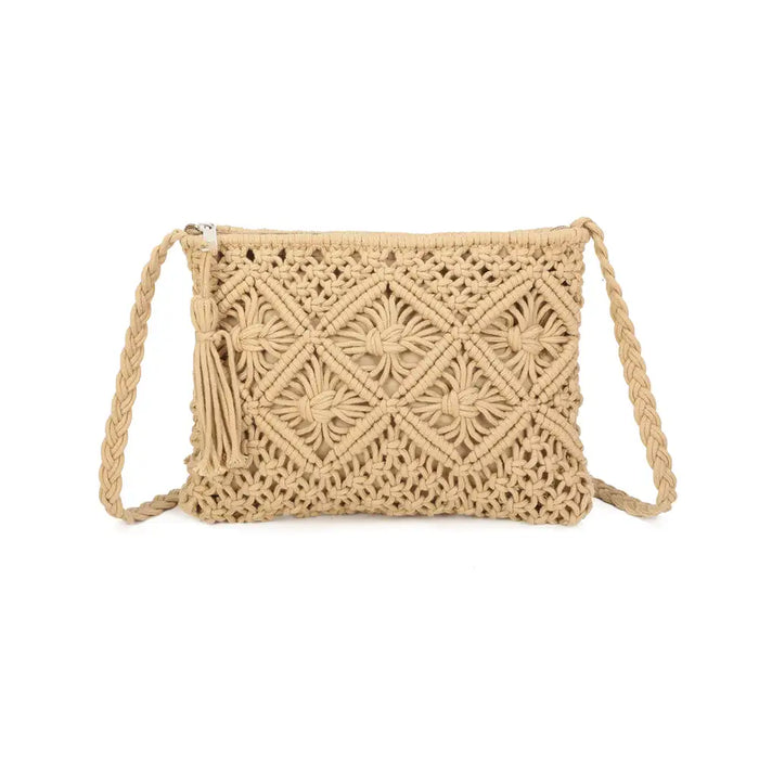 A natural beige macrame shoulder bag with a woven geometric pattern, braided strap, and tassel detail, shown against a plain white background.