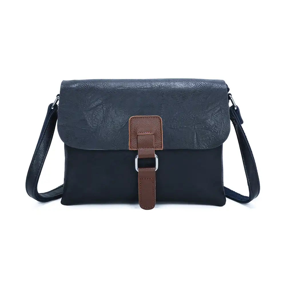 Navy satchel bag with a brown tab and silver hoop detail. On a white background 