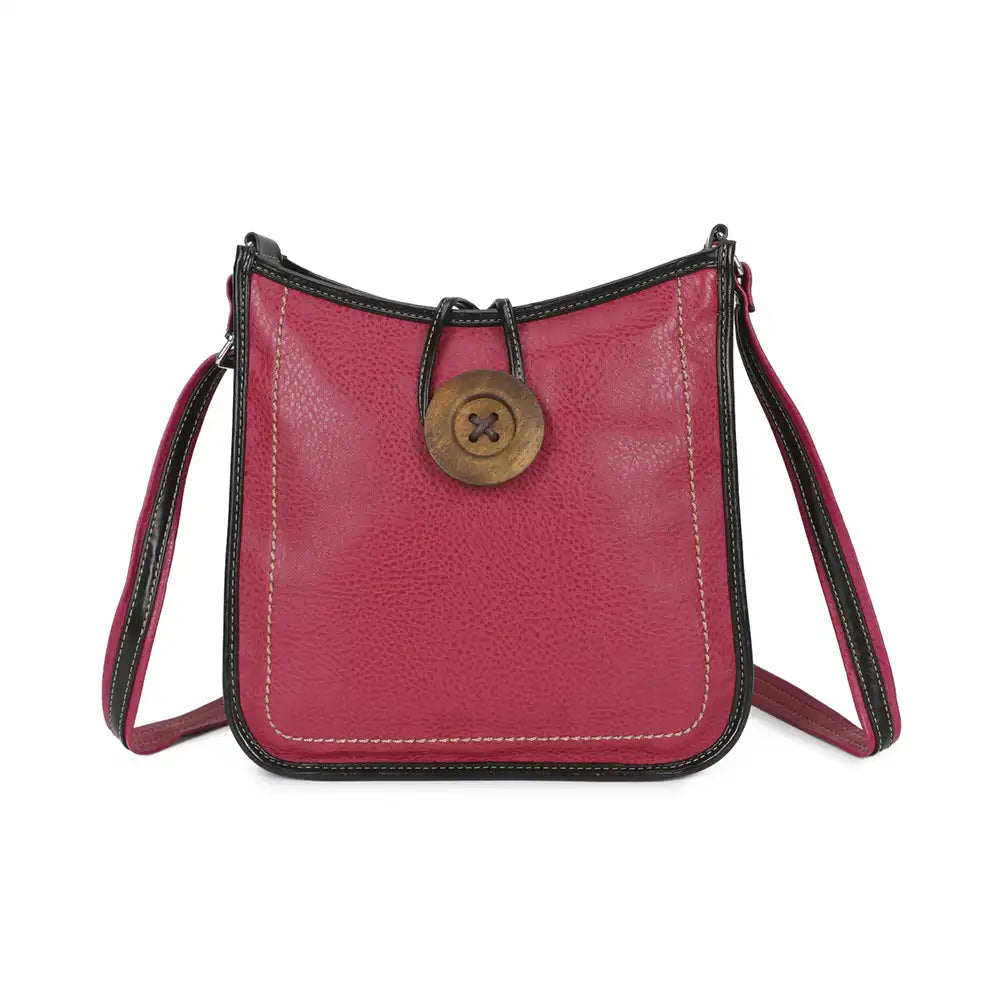 A small pebbled leather shoulder bag in a deep magenta pink, featuring black leather trim, a central brass button closure, and a matching pink leather strap.