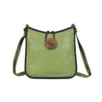 A green pebbled leather shoulder bag with black trim and a large round wooden button closure on the front, shown against a plain white background.
