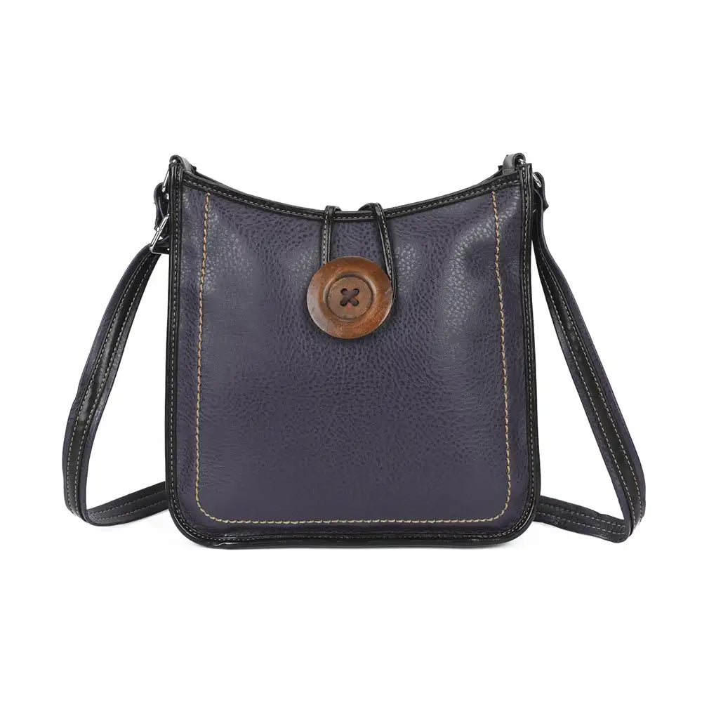 A dark navy blue pebbled leather crossbody bag with a prominent round wooden button closure on the front and light-colored contrast stitching, shown against a plain white background.