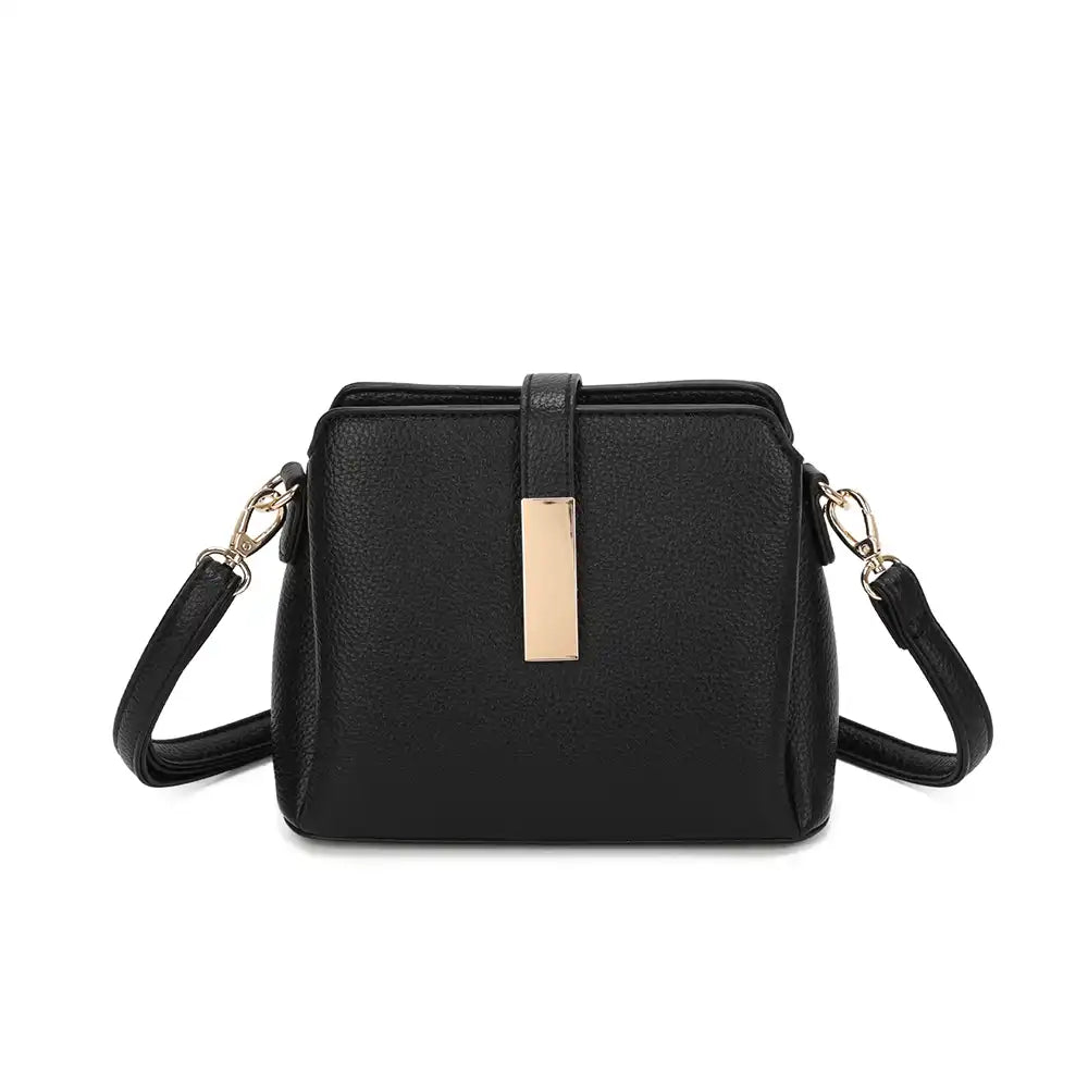 Black handbag with gold accents on a white background