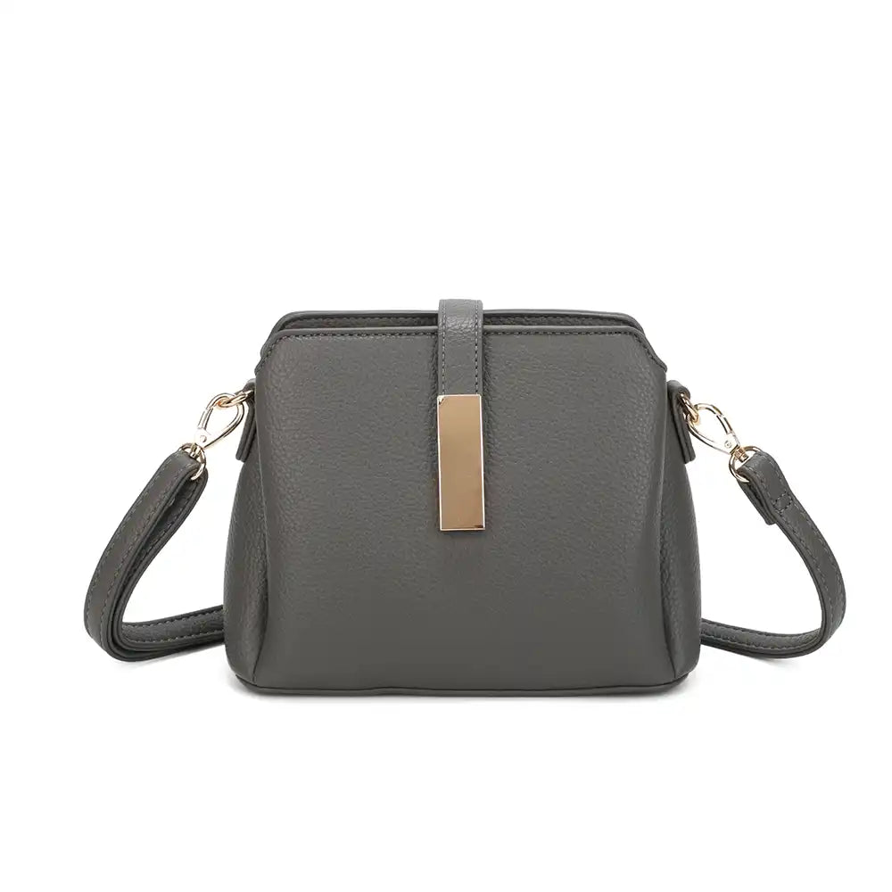 A dark grey pebbled faux leather crossbody handbag with a gold-tone rectangular metal accent on the front and matching shoulder strap, shown against a plain white background.