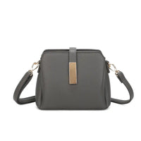 A dark grey pebbled faux leather crossbody handbag with a gold-tone rectangular metal accent on the front and matching shoulder strap, shown against a plain white background.