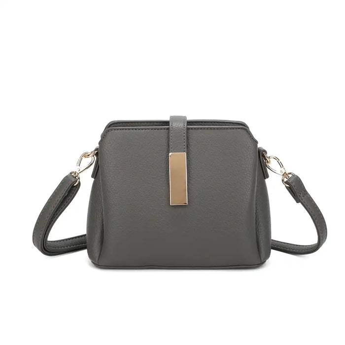 A dark grey pebbled faux leather crossbody handbag with a gold-tone rectangular metal accent on the front and matching shoulder strap, shown against a plain white background.