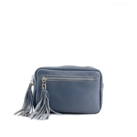 Landscape leather bag in blue with a zip pocket on the front and top. Zips have silver hardware with a tassel tab. 