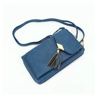 Royal Blue phone bag with cross body strap and tassle on the front . 