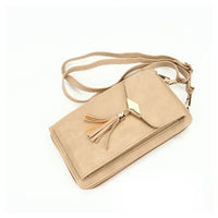 Rectangular beige bag with a flap pocket that has a gold metal plinth at the end with a tassel. Gold hard ware attaching a beige strap.