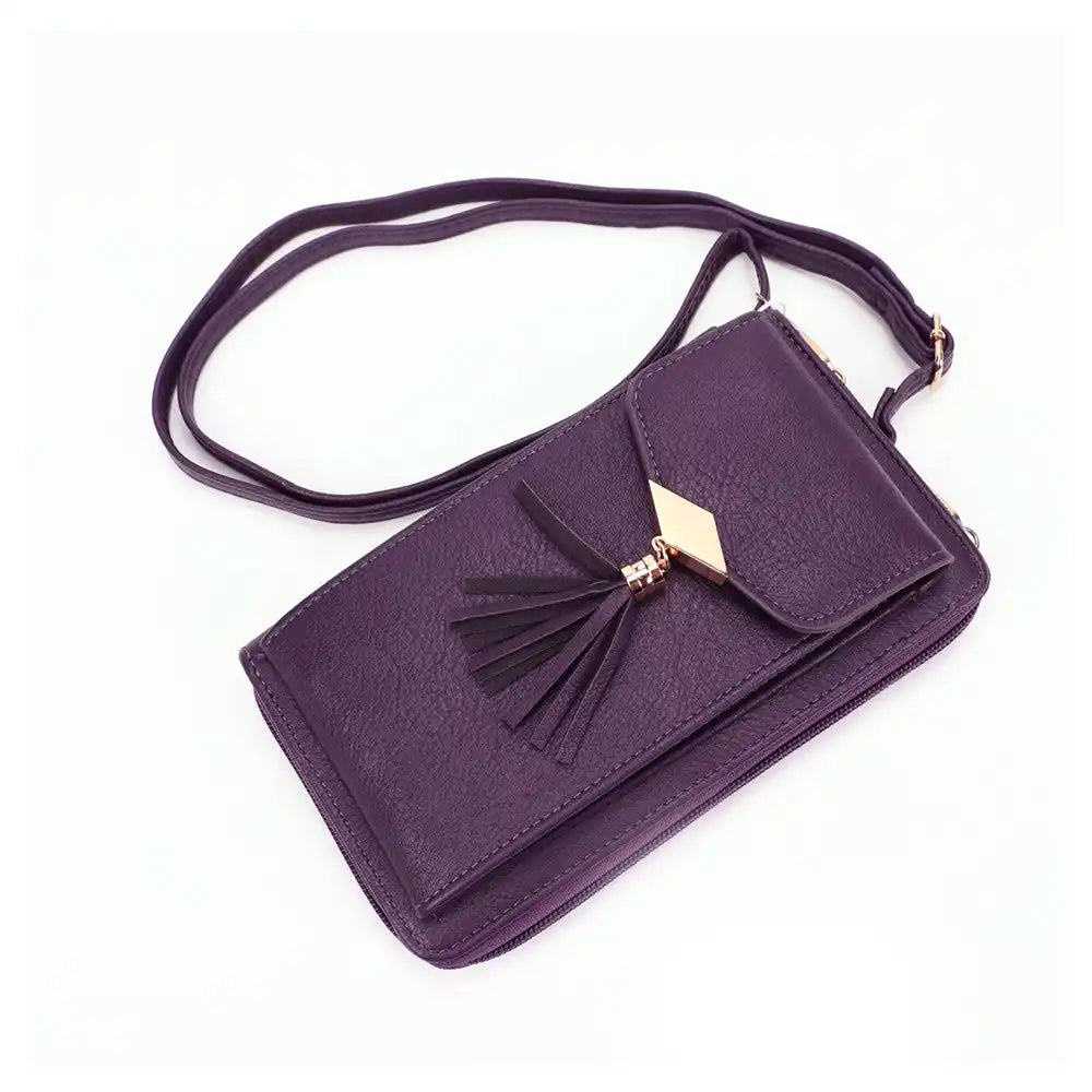 Rectangular purple bag with a flap pocket that has a gold metal plinth at the end with a tassel. Gold hard ware attaching a beige strap.